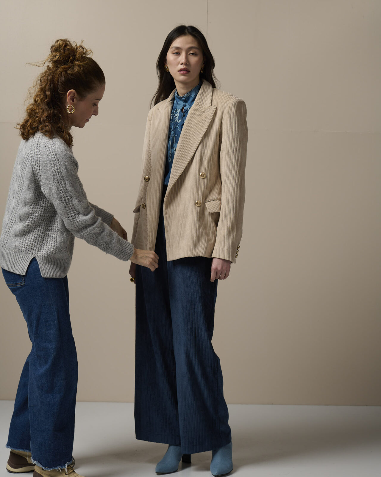 anna paola with model wearing beige blazer wearing luxury womenswear collection